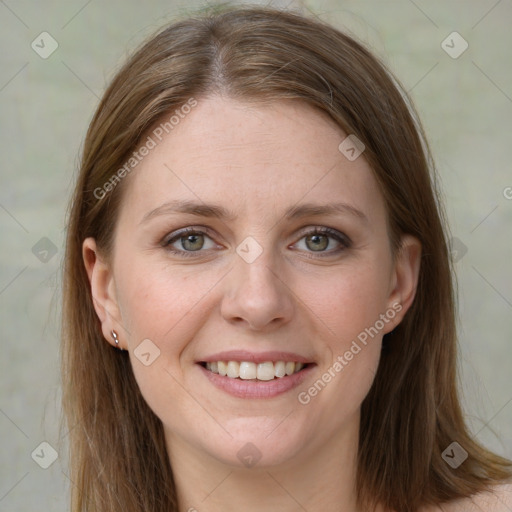 Joyful white young-adult female with long  brown hair and green eyes