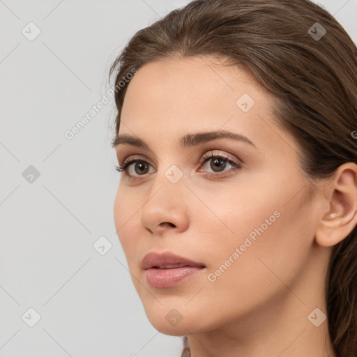 Neutral white young-adult female with long  brown hair and brown eyes