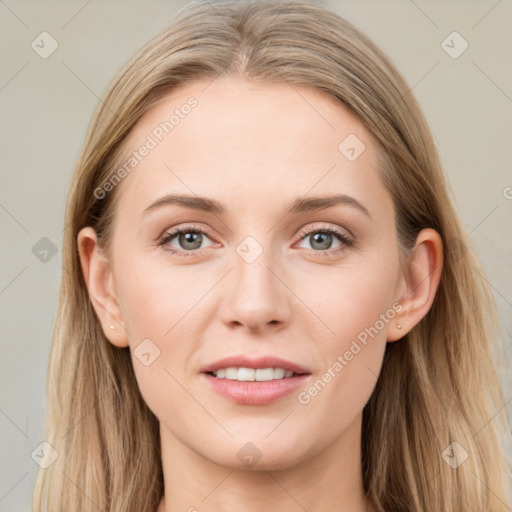 Joyful white young-adult female with long  brown hair and blue eyes