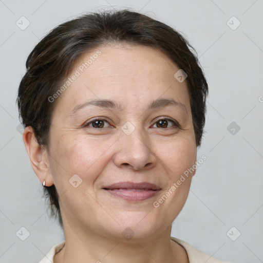 Joyful white adult female with short  brown hair and brown eyes