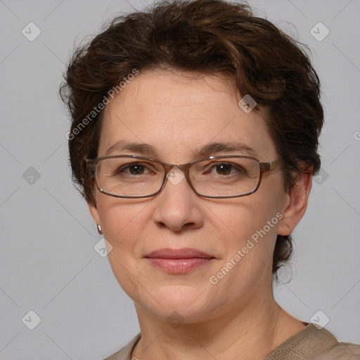 Joyful white adult female with medium  brown hair and blue eyes