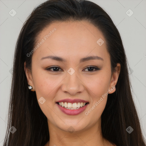 Joyful asian young-adult female with long  brown hair and brown eyes