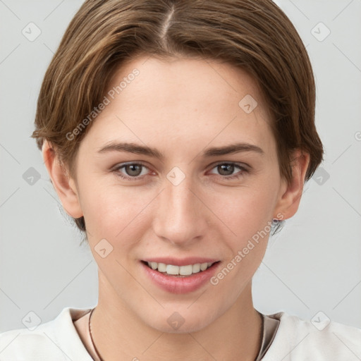 Joyful white young-adult female with short  brown hair and grey eyes