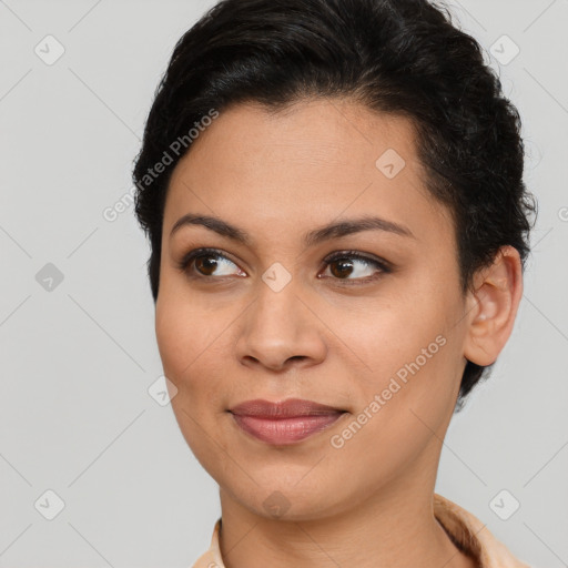 Joyful latino young-adult female with short  brown hair and brown eyes