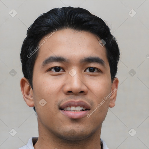 Joyful asian young-adult male with short  black hair and brown eyes