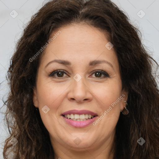 Joyful white adult female with long  brown hair and brown eyes