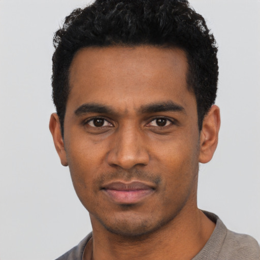 Neutral black young-adult male with short  black hair and brown eyes