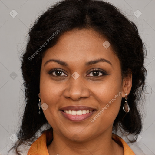 Joyful black adult female with medium  brown hair and brown eyes