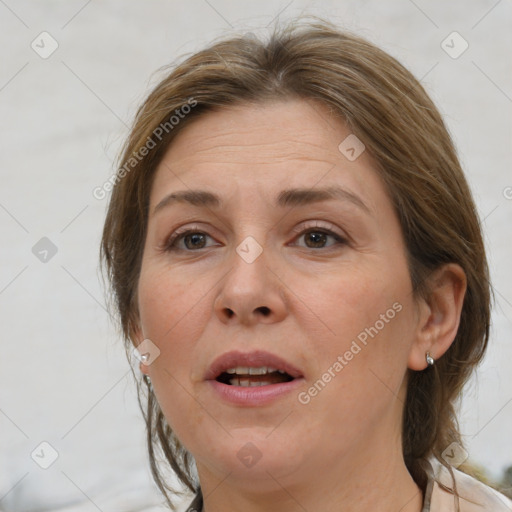 Joyful white adult female with medium  brown hair and brown eyes