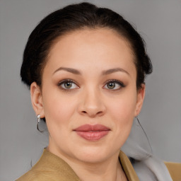 Joyful white young-adult female with medium  brown hair and grey eyes