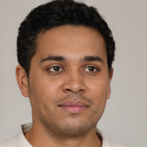 Neutral latino young-adult male with short  brown hair and brown eyes