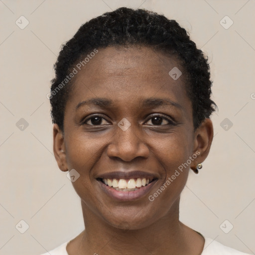 Joyful black young-adult female with short  black hair and brown eyes