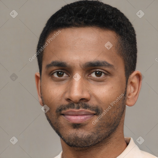 Joyful latino young-adult male with short  black hair and brown eyes