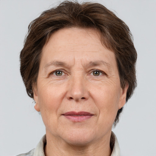 Joyful white middle-aged female with short  brown hair and grey eyes