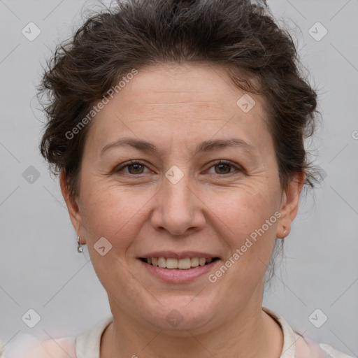 Joyful white adult female with short  brown hair and brown eyes