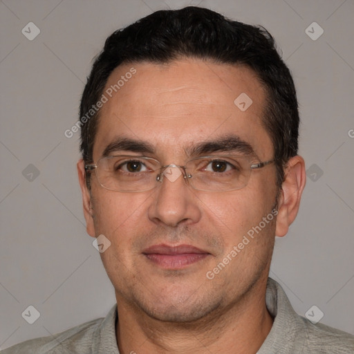 Joyful white adult male with short  black hair and brown eyes