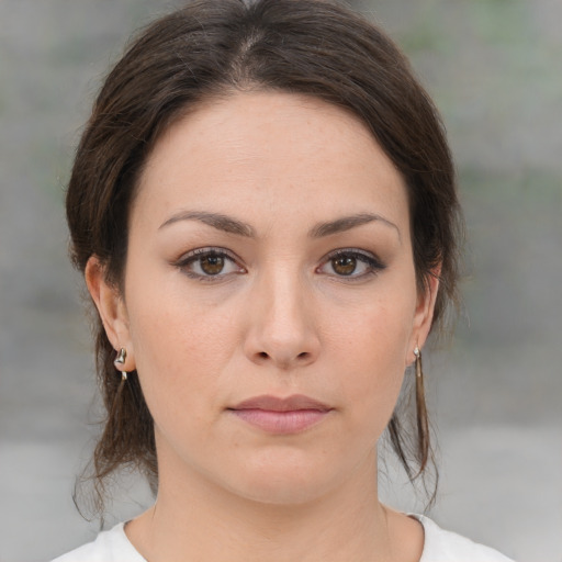 Neutral white young-adult female with medium  brown hair and brown eyes