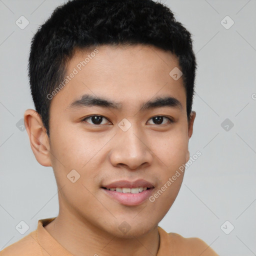 Joyful asian young-adult male with short  black hair and brown eyes