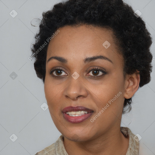 Joyful black young-adult female with short  brown hair and brown eyes