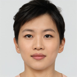 Joyful asian young-adult female with short  brown hair and brown eyes