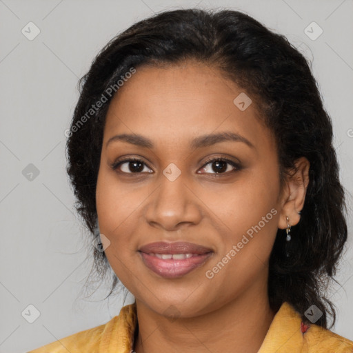 Joyful black young-adult female with long  brown hair and brown eyes