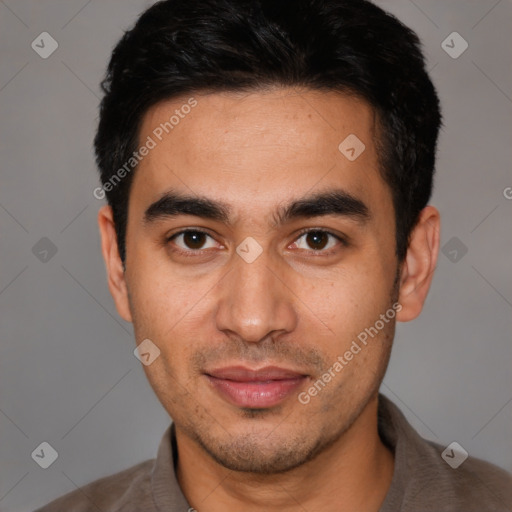 Joyful latino young-adult male with short  black hair and brown eyes
