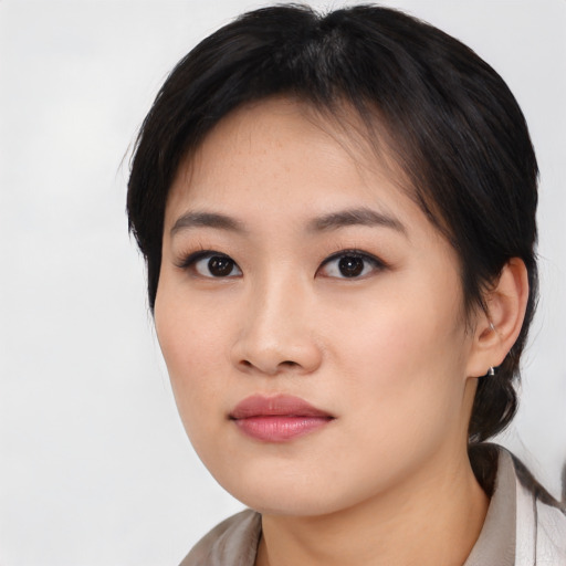 Neutral asian young-adult female with medium  black hair and brown eyes