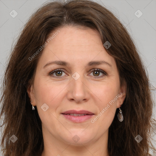 Joyful white adult female with long  brown hair and brown eyes