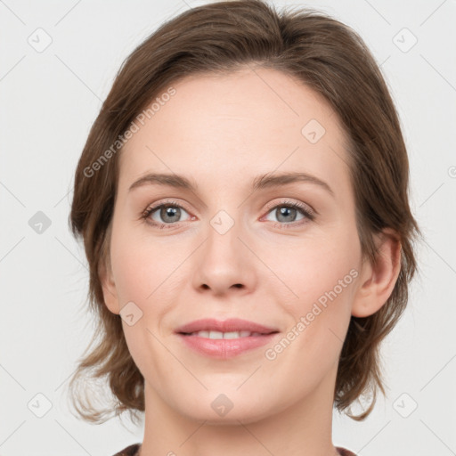 Joyful white young-adult female with medium  brown hair and green eyes