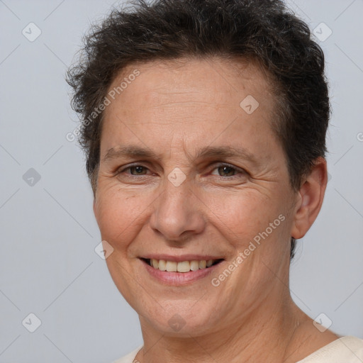 Joyful white adult female with short  brown hair and brown eyes