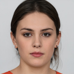 Neutral white young-adult female with medium  brown hair and brown eyes