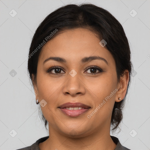 Joyful latino young-adult female with medium  brown hair and brown eyes