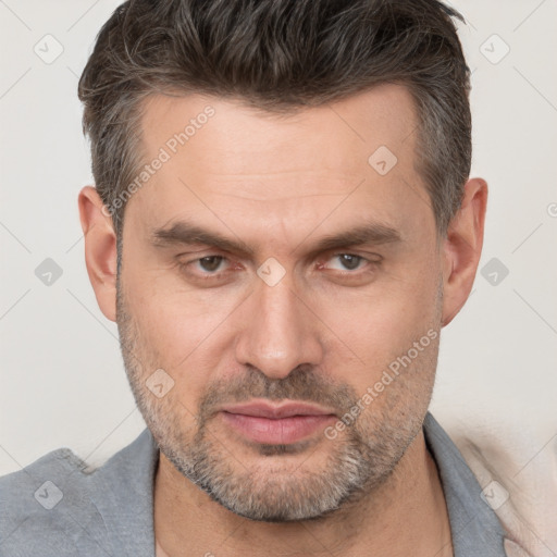 Neutral white adult male with short  brown hair and brown eyes