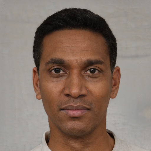 Neutral black adult male with short  black hair and brown eyes