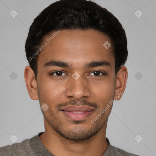 Joyful latino young-adult male with short  brown hair and brown eyes