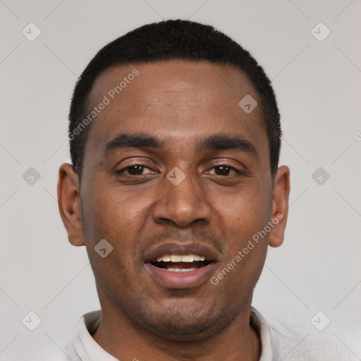 Joyful black young-adult male with short  black hair and brown eyes