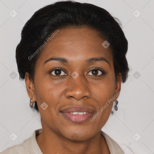 Joyful black adult female with short  brown hair and brown eyes