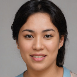 Joyful asian young-adult female with medium  brown hair and brown eyes