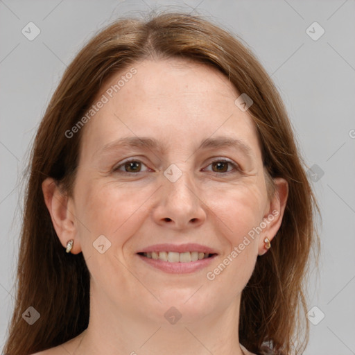 Joyful white adult female with medium  brown hair and grey eyes