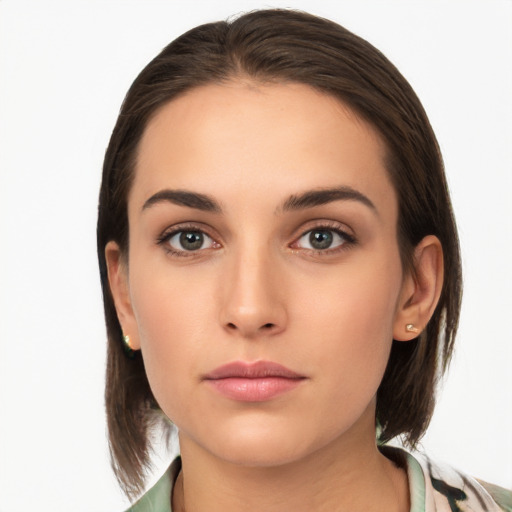 Neutral white young-adult female with medium  brown hair and brown eyes