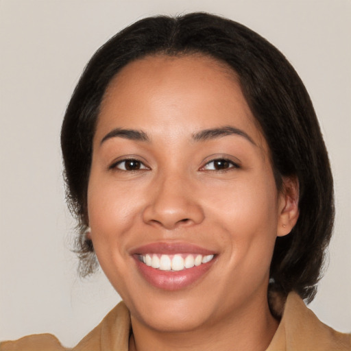 Joyful latino young-adult female with medium  brown hair and brown eyes