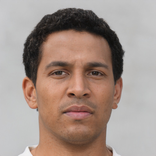 Neutral latino young-adult male with short  brown hair and brown eyes