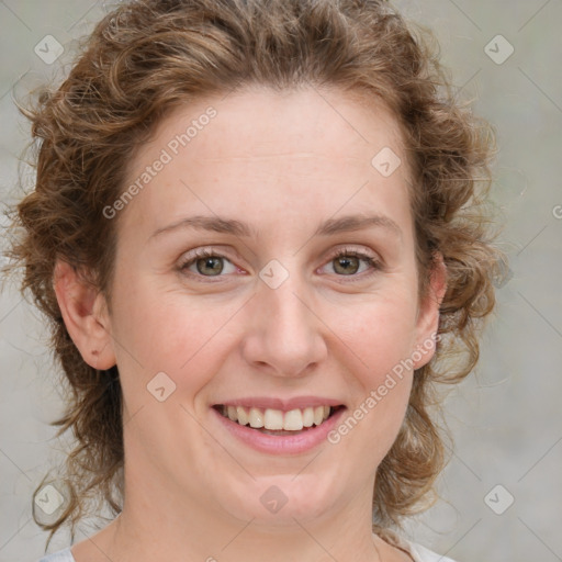 Joyful white young-adult female with medium  brown hair and blue eyes