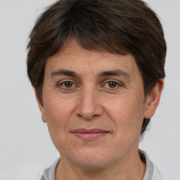 Joyful white adult female with short  brown hair and brown eyes