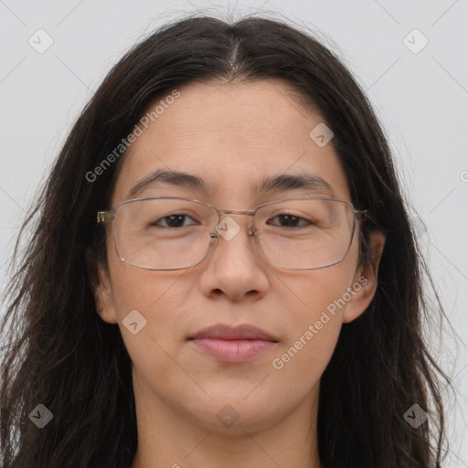 Joyful white adult female with long  brown hair and brown eyes