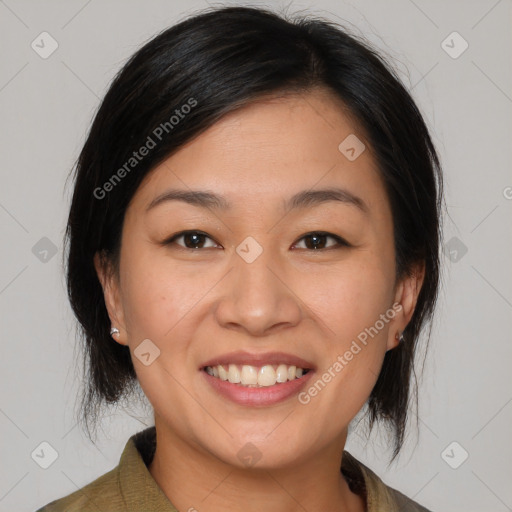 Joyful asian young-adult female with medium  brown hair and brown eyes