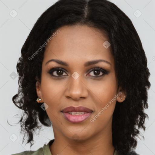 Joyful black young-adult female with long  black hair and brown eyes