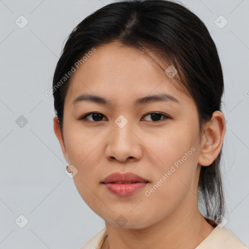 Joyful asian young-adult female with short  brown hair and brown eyes