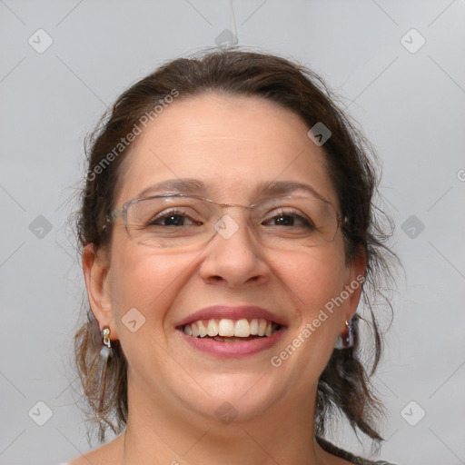 Joyful white adult female with medium  brown hair and blue eyes