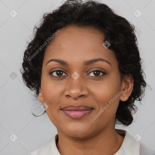 Joyful black adult female with medium  brown hair and brown eyes